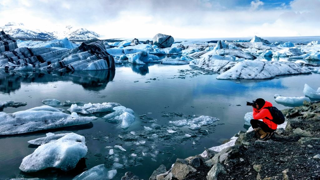 Sophia Brañes taking picture of glacier in Iceland